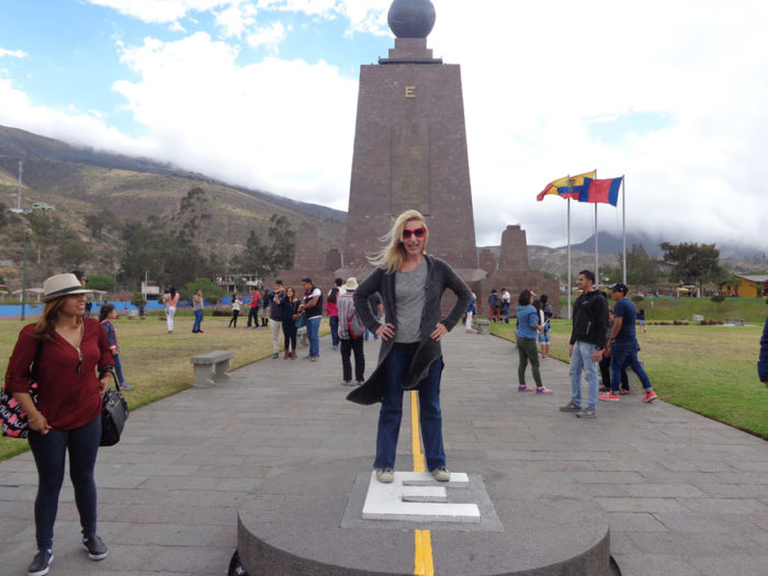 Alexandra Kollaros posing with feet on both hemispheres