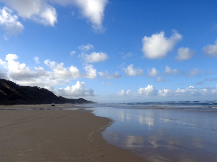 car crossing 75 mile beach