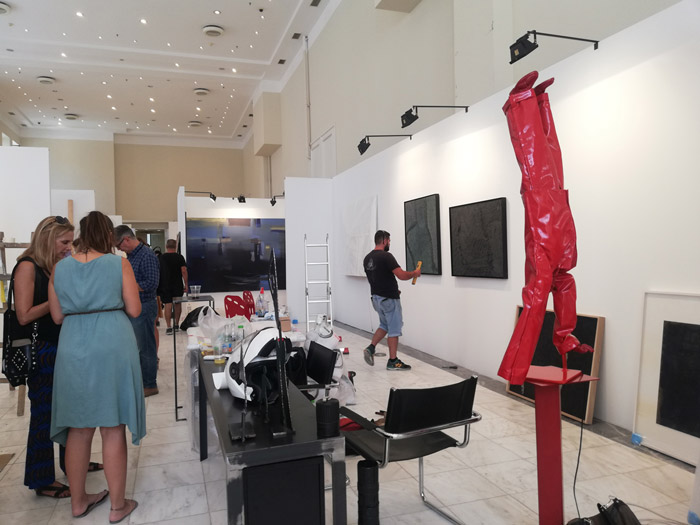 red sculpture and people at art athina 2019