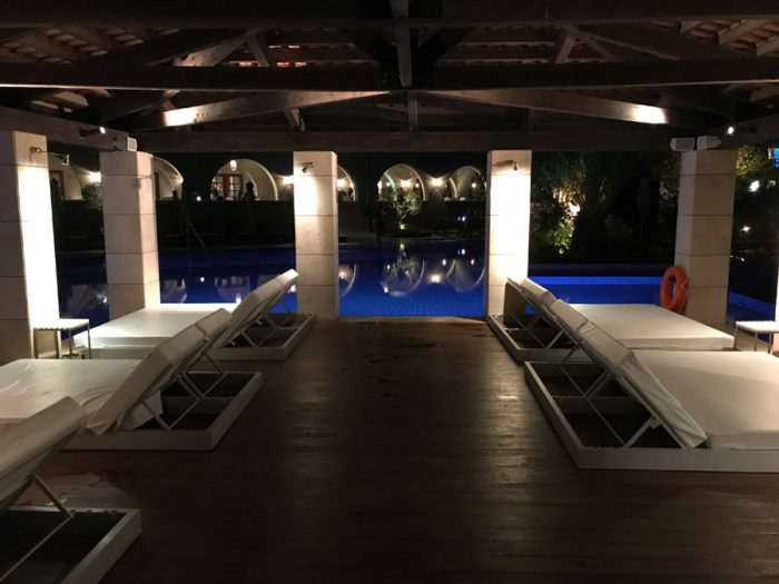 Romanos pool loungers at night