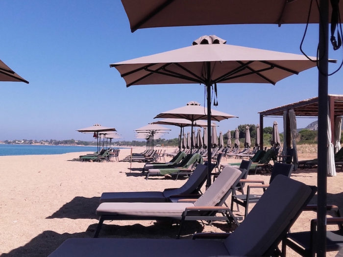 beach loungers at costa navarino beach