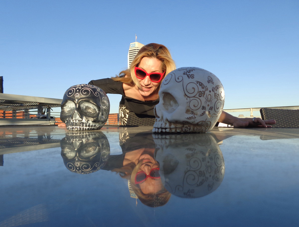 Alexandra Kollaros and skull artworks portraits Downtown Houston