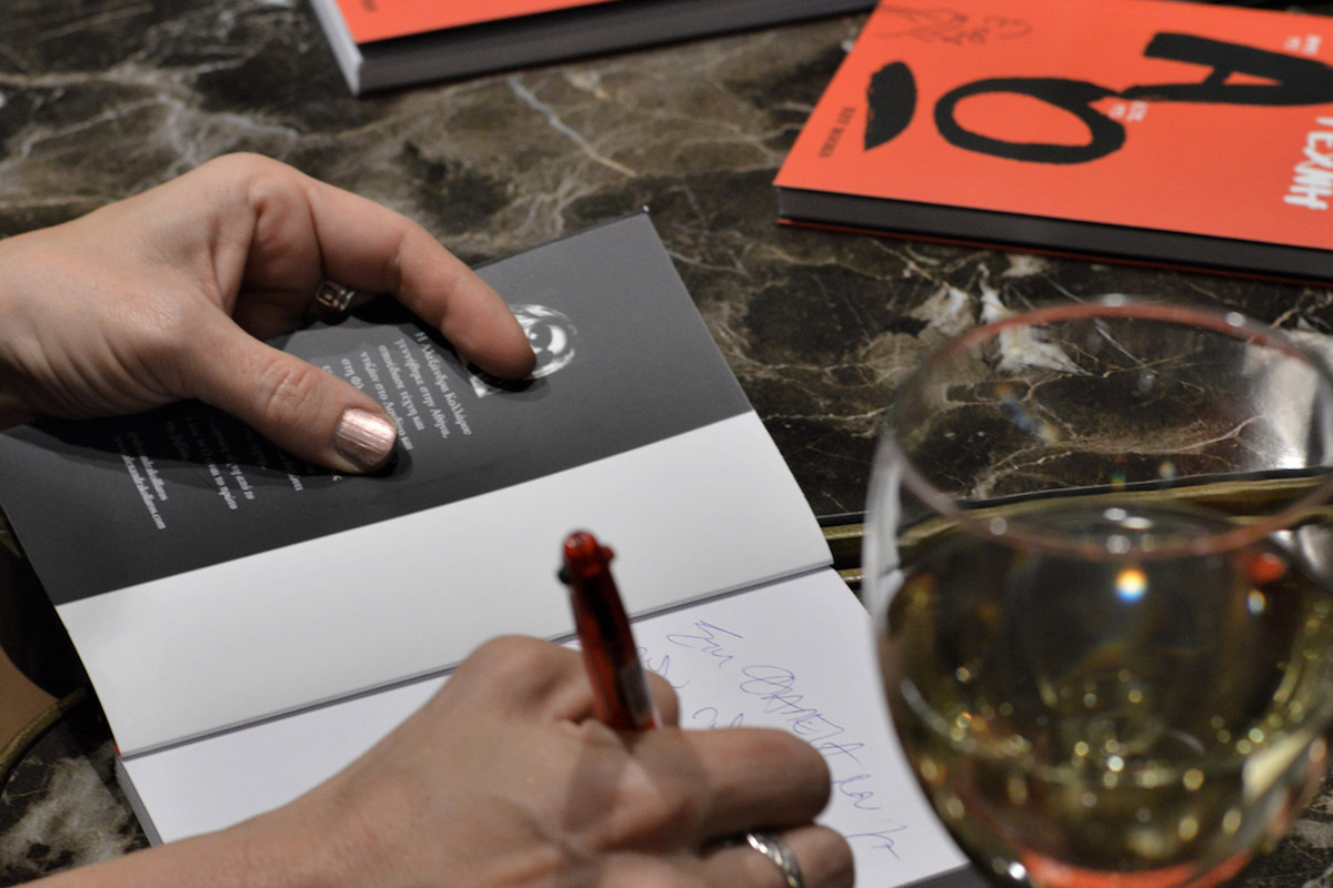 Alexandra Kollaros signing her book at Public Bookstores
