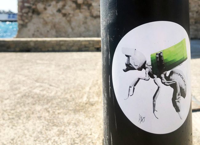 police bee paste up by Ludo in Greece