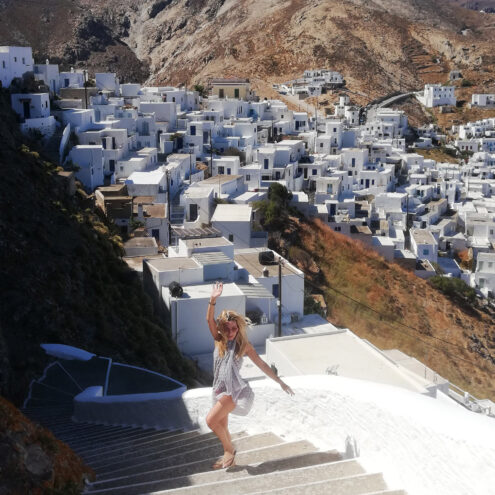 Alexandra Kollaros in front of Serifos Chora white houses
