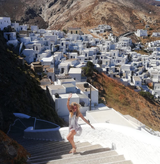 Alexandra Kollaros in front of Serifos Chora white houses