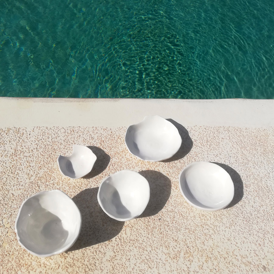 Five white ceramic bowls