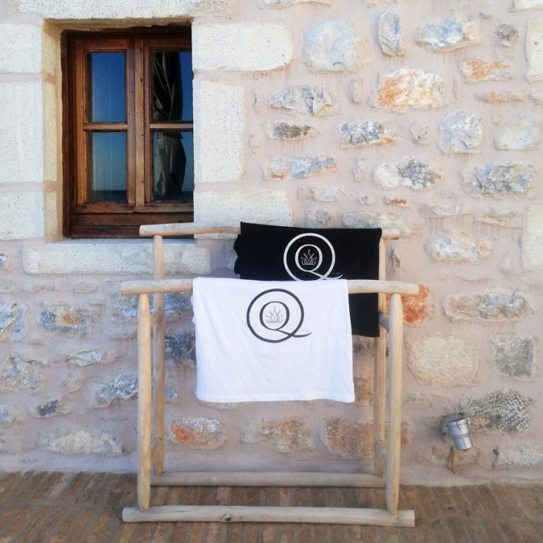 Black & White t-shirts on wooden hangers